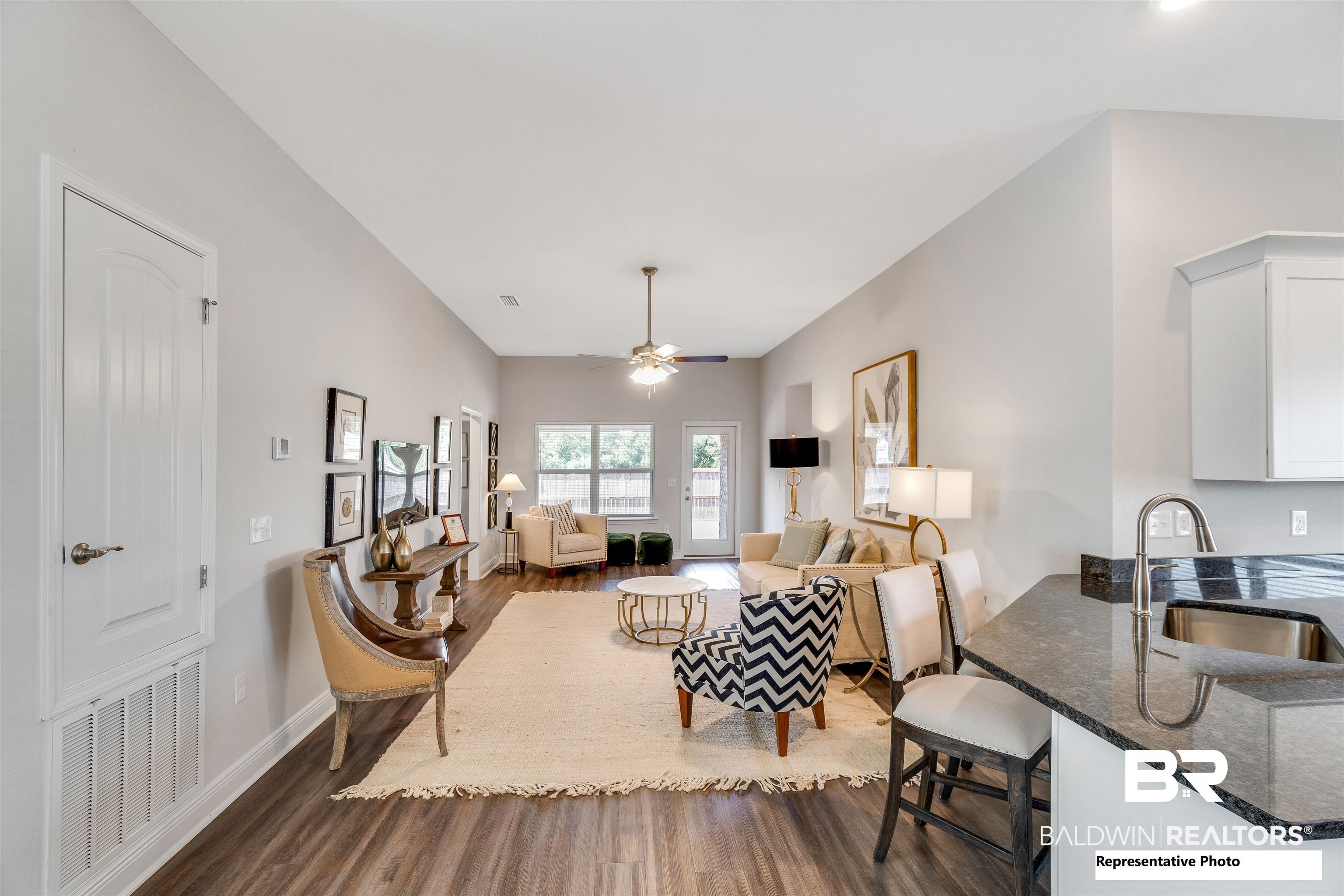 643 Mayflower Drive Foley, AL 36535 - Photo 19 of 34 Living area with dark wood-style floors, visible vents, ceiling fan, and baseboards
