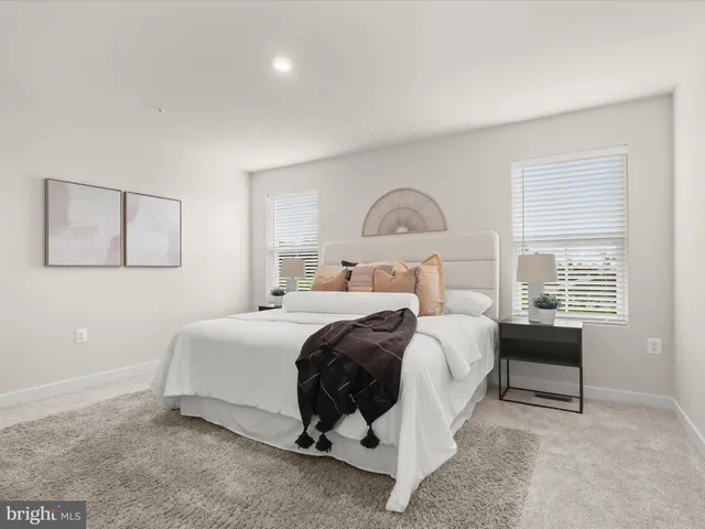 a bedroom with a bed and a mirror