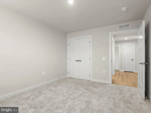a bathroom with a sink toilet and mirror