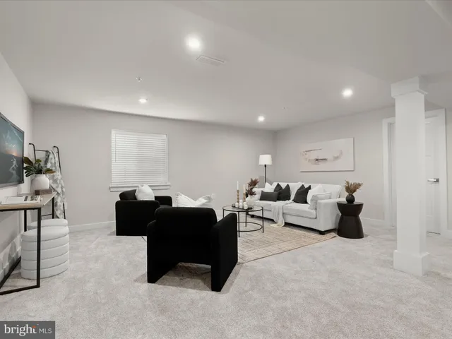 a view of empty room with wooden walls