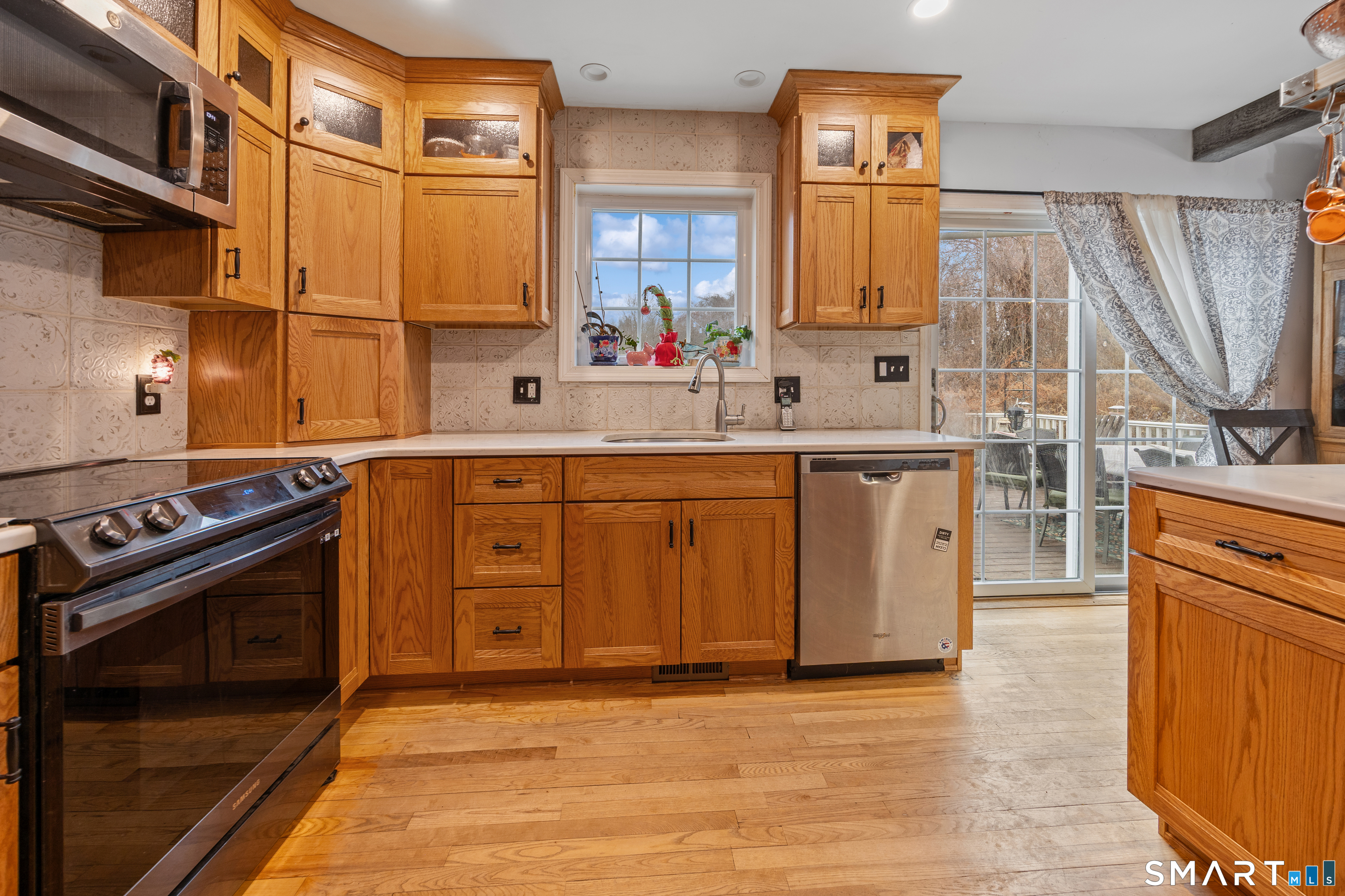 197 Preston Road Plymouth, CT 06786 - Photo 7 of 39 a kitchen with stainless steel appliances granite countertop a stove a sink and a microwave