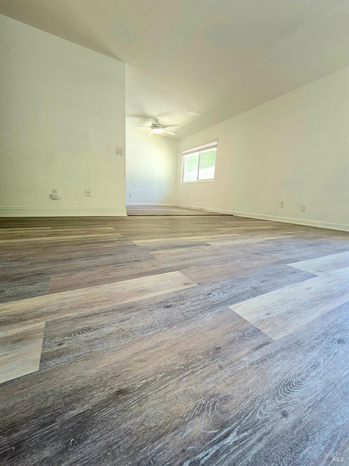 140 Del Rio Court, Unit 4 Vacaville, CA 95687 - Photo 8 of 25 a view of a room with wooden floor and window