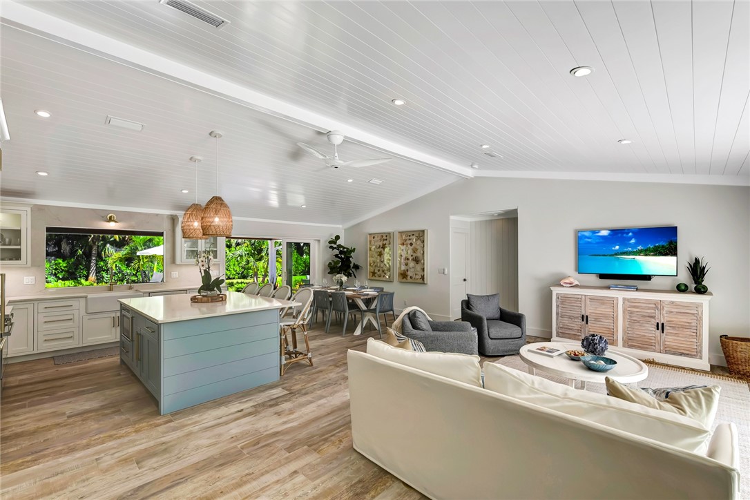 525 Banyan Road Vero Beach, FL 32963 - Photo 11 of 36 a living room with fireplace furniture and a flat screen tv