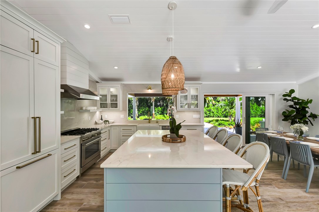525 Banyan Road Vero Beach, FL 32963 - Photo 15 of 36 a kitchen with counter top space appliances and windows