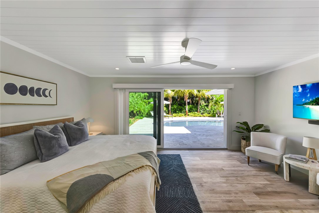 525 Banyan Road Vero Beach, FL 32963 - Photo 20 of 36 a bedroom with furniture and a large window