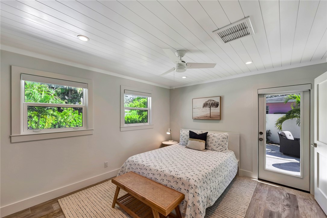 525 Banyan Road Vero Beach, FL 32963 - Photo 23 of 36 a bedroom with a large bed and a window