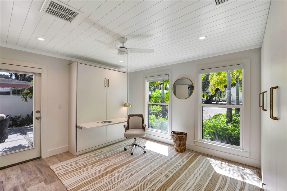 525 Banyan Road Vero Beach, FL 32963 - Photo 26 of 36 a very nice looking room with a large window and wooden floor