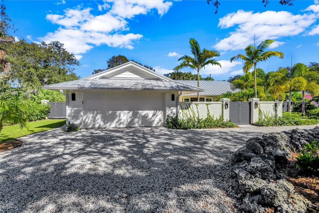 525 Banyan Road Vero Beach, FL 32963 - Photo 35 of 36 a front view of a house with a yard
