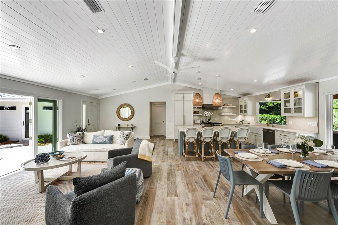525 Banyan Road Vero Beach, FL 32963 - Photo 8 of 36 a living room with lots of furniture and view of kitchen