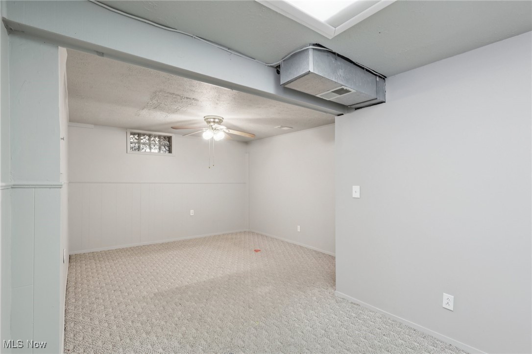 611 Wilson Street Struthers, OH 44471 - Photo 37 of 44 Finished basement featuring carpet floors and a ceiling fan