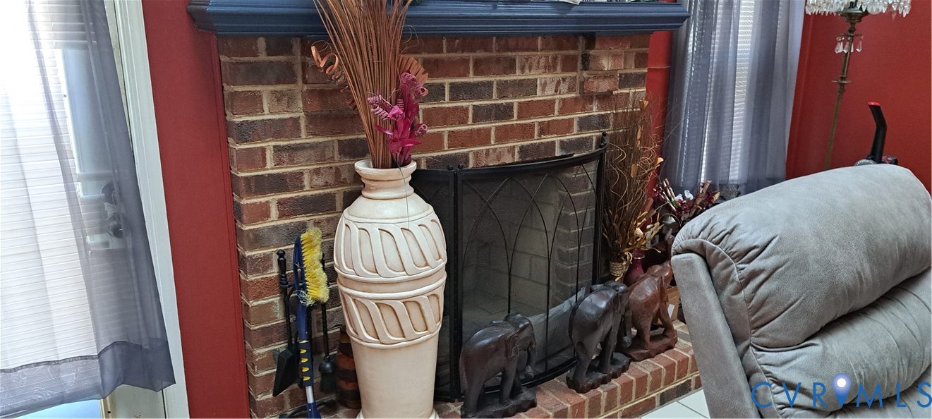 10401 Hamlin Place Chester, VA 23831 - Photo 2 of 19 Detailed view of a brick fireplace