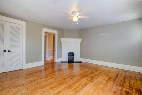 a view of an empty room and wooden floor
