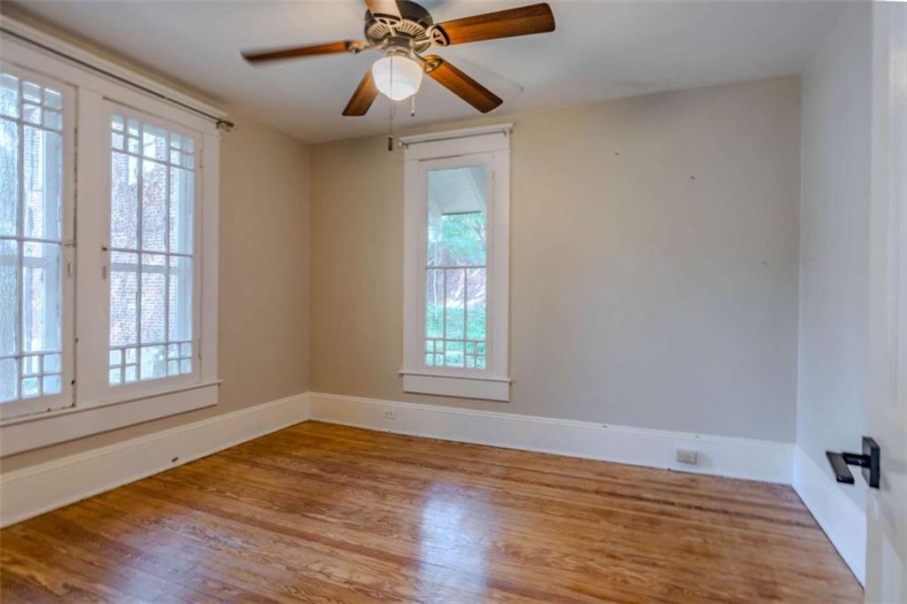 214 East 3rd Street Rome, GA 30161 - Photo 26 of 33 an empty room with wooden floor fan and windows