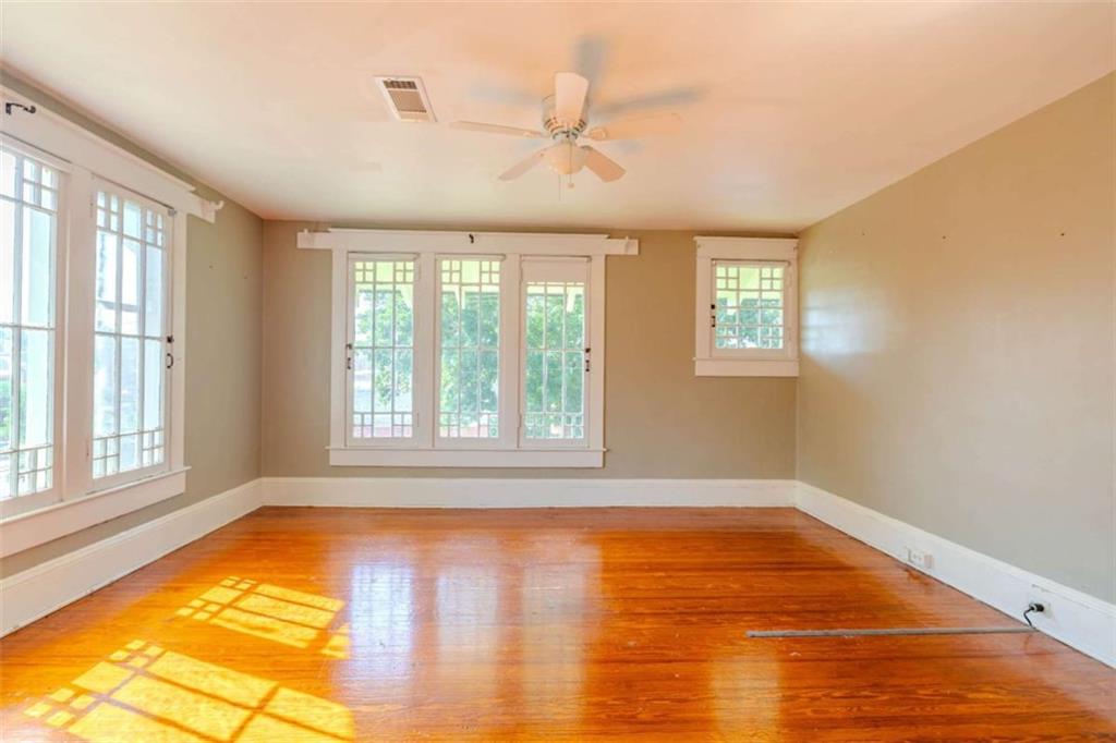 214 East 3rd Street Rome, GA 30161 - Photo 29 of 33 a view of an empty room with a window and wooden floor