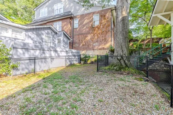 a kitchen with stainless steel appliances granite countertop a stove a microwave and a refrigerator