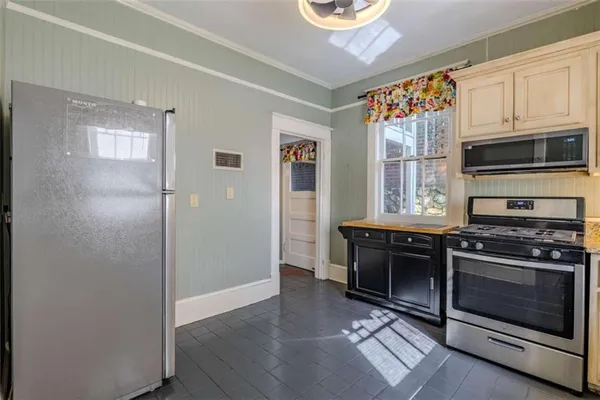 a kitchen with stainless steel appliances granite countertop a stove and a sink
