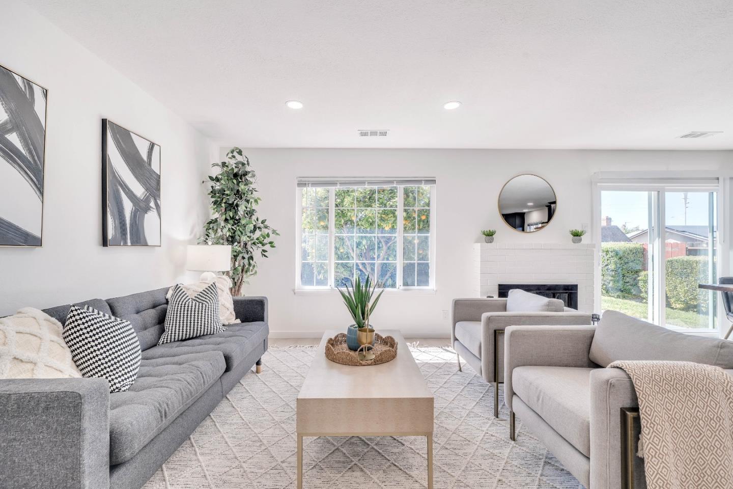 36033 Brandywine Street Newark, CA 94560 - Photo 7 of 41 a living room with furniture and a large window