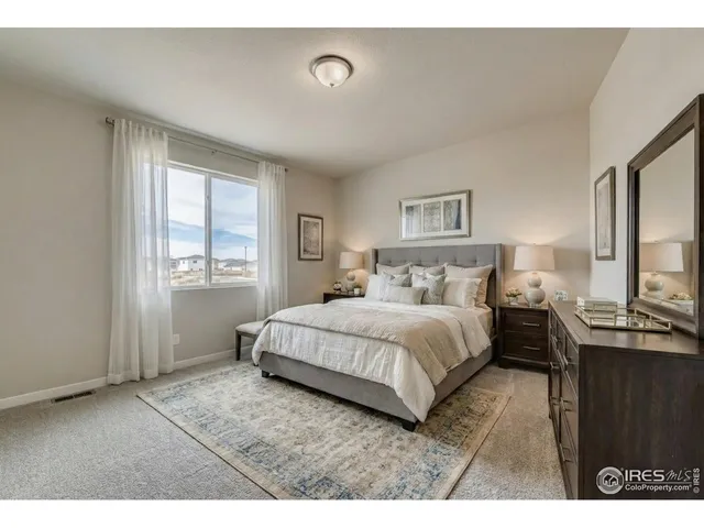 a kitchen with stainless steel appliances granite countertop a sink a stove a refrigerator and island