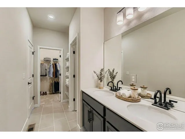 a bedroom with a bed and with furniture