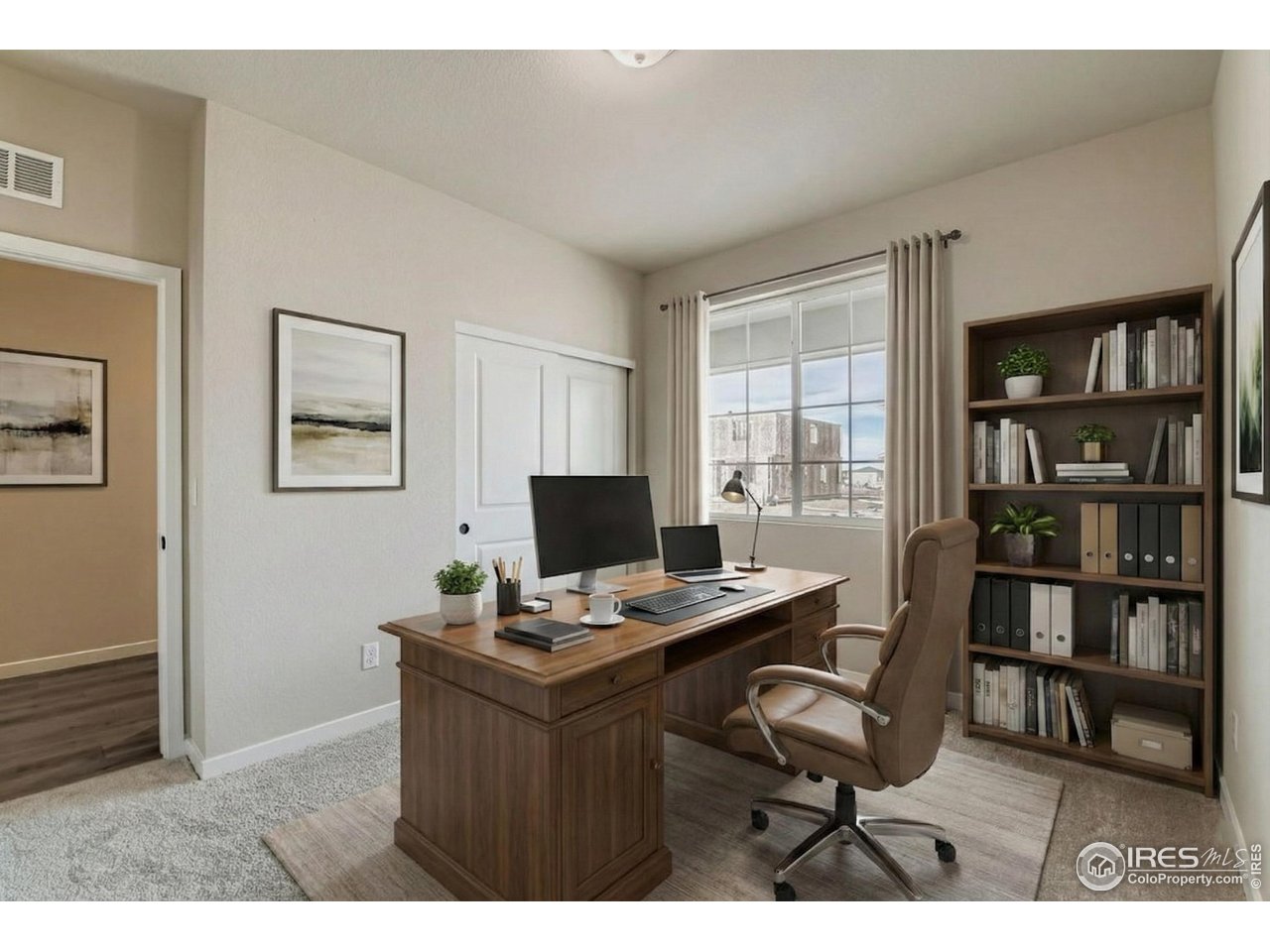 7348 Arkansas Street Frederick, CO 80530 - Photo 14 of 18 a view of a workspace with furniture and a bookshelf