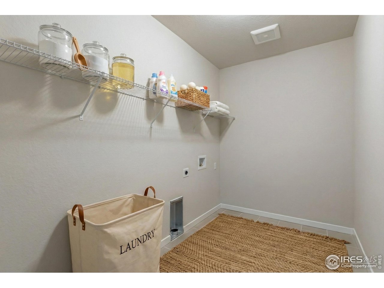 7348 Arkansas Street Frederick, CO 80530 - Photo 17 of 18 a view of a room with rack on the wall