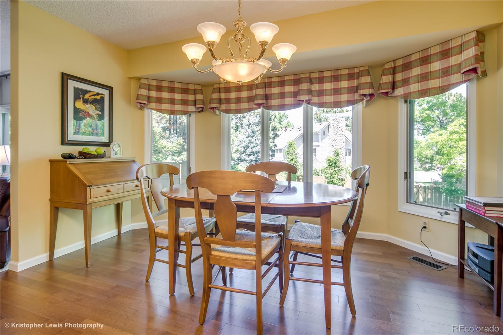 8247 Lodgepole Trail Lone Tree, CO 80124 - Photo 12 of 35 a view of a dining room with furniture window and outside view