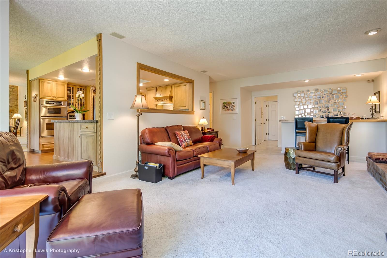 8247 Lodgepole Trail Lone Tree, CO 80124 - Photo 14 of 35 a living room with furniture and a table