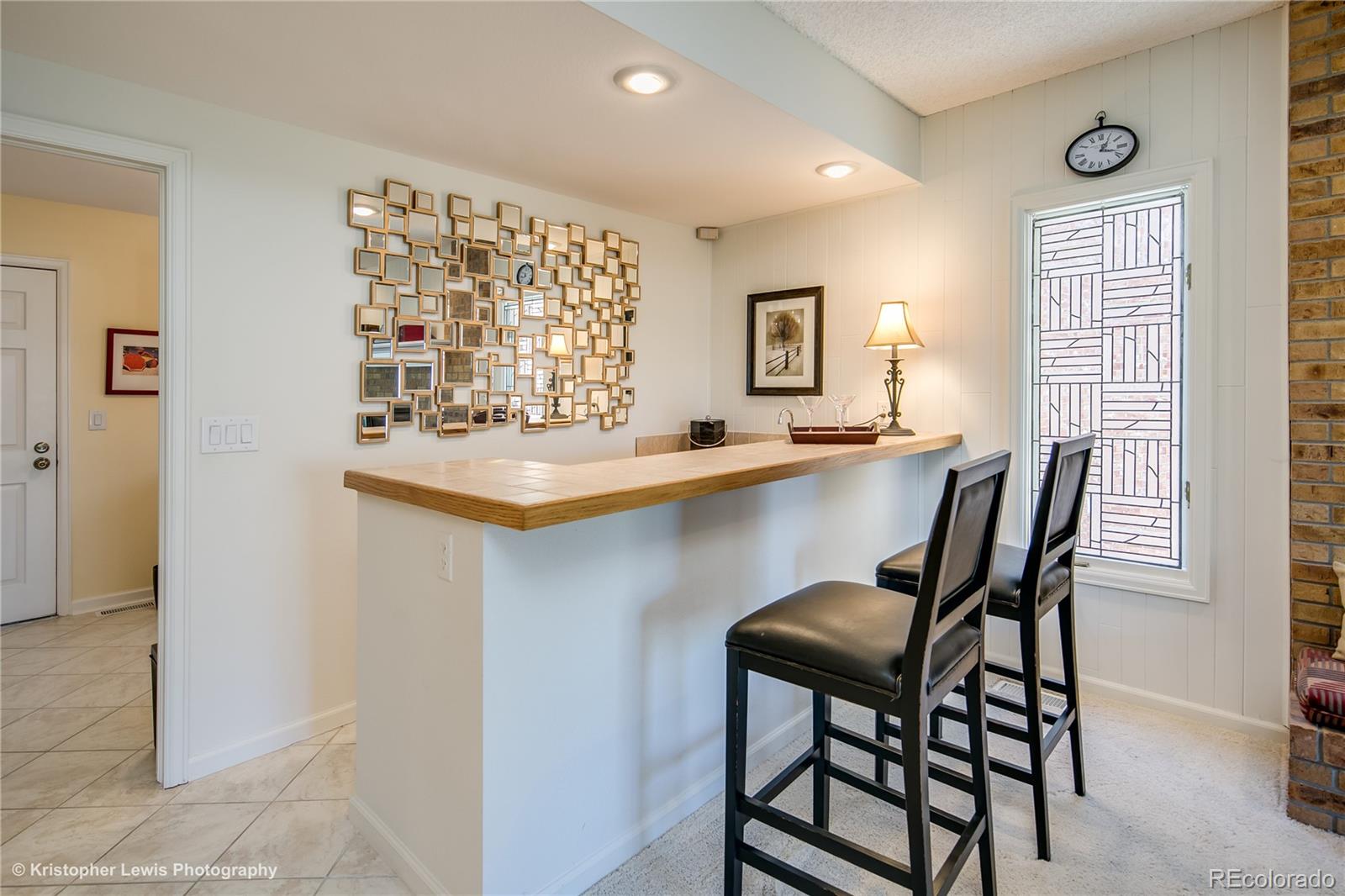8247 Lodgepole Trail Lone Tree, CO 80124 - Photo 16 of 35 a dining room with a window and chairs