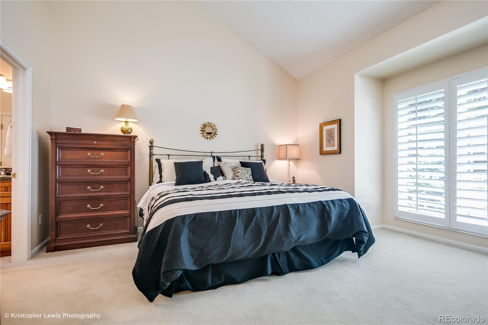 8247 Lodgepole Trail Lone Tree, CO 80124 - Photo 18 of 35 a spacious bedroom with a bed and a window
