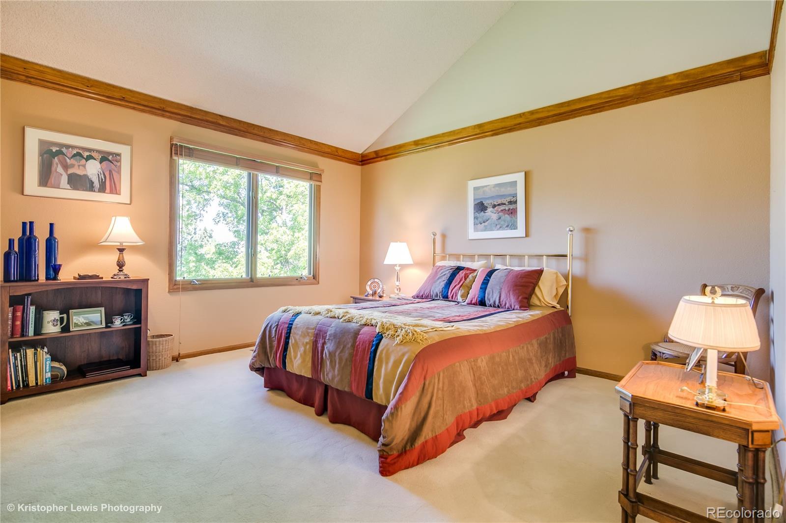 8247 Lodgepole Trail Lone Tree, CO 80124 - Photo 26 of 35 a bedroom with a bed and furniture
