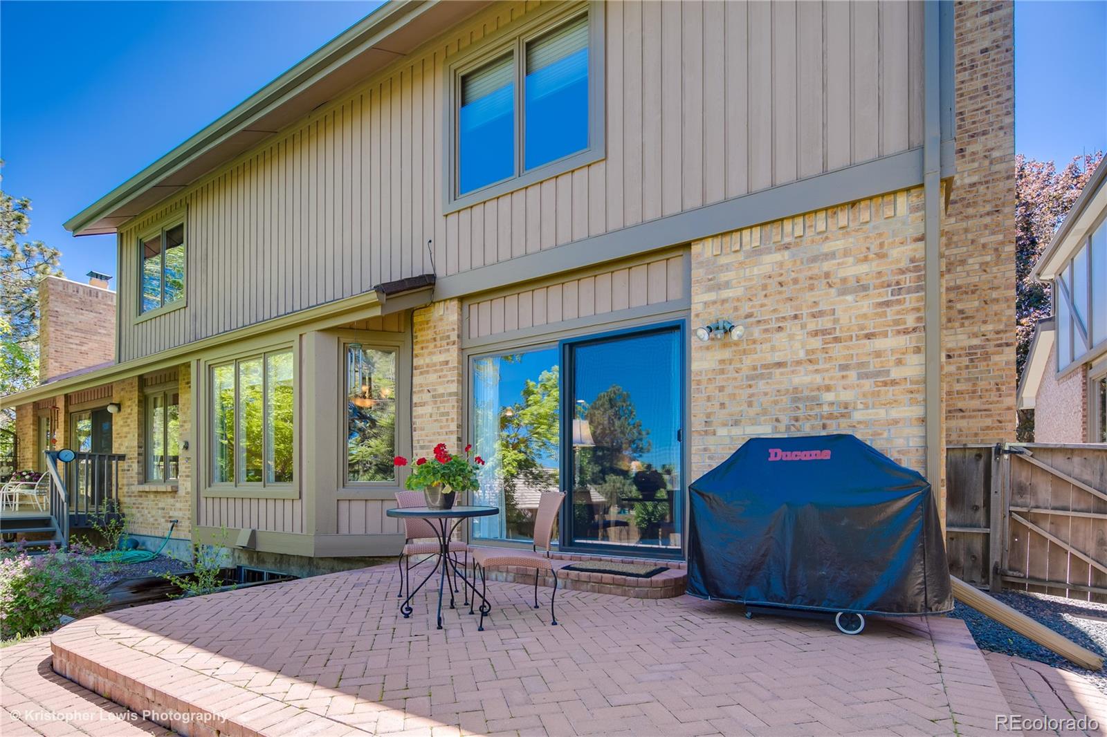 8247 Lodgepole Trail Lone Tree, CO 80124 - Photo 33 of 35 a view of backyard with outdoor seating and plants