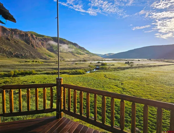 a view of a balcony with an ocean view