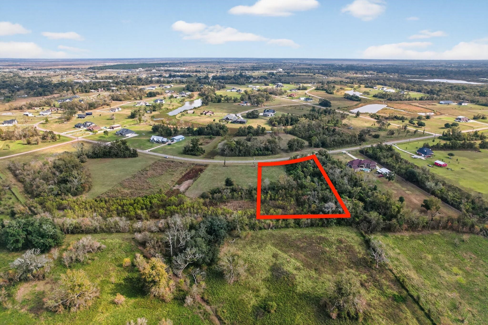 22818 Pittman Drive Angleton, TX 77515 - Photo 1 of 9 an aerial view of residential houses with outdoor space