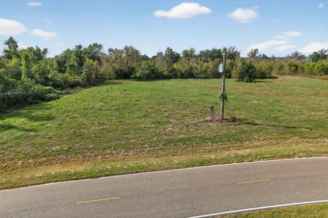 a view of a lake with a yard