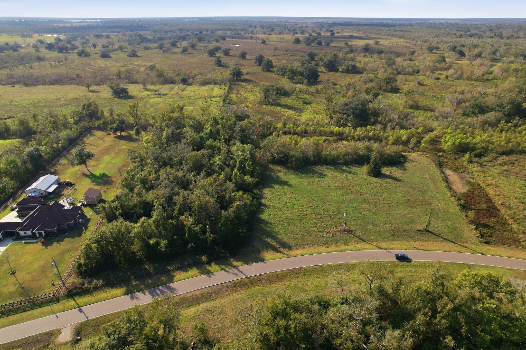 22818 Pittman Drive Angleton, TX 77515 - Photo 6 of 9 an aerial view of a houses with a yard