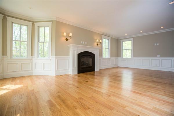 245 Glen Road Weston, MA 02493 - Photo 3 of 26 a view of empty room with wooden floor and fireplace