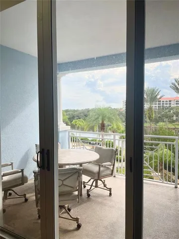 a view of living room with furniture and floor to ceiling window