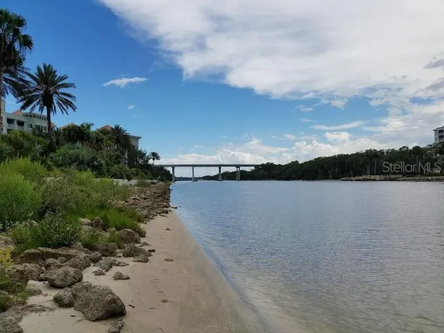 an aerial view of a house with a lake view