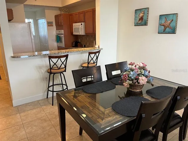 a view of a dining room with furniture
