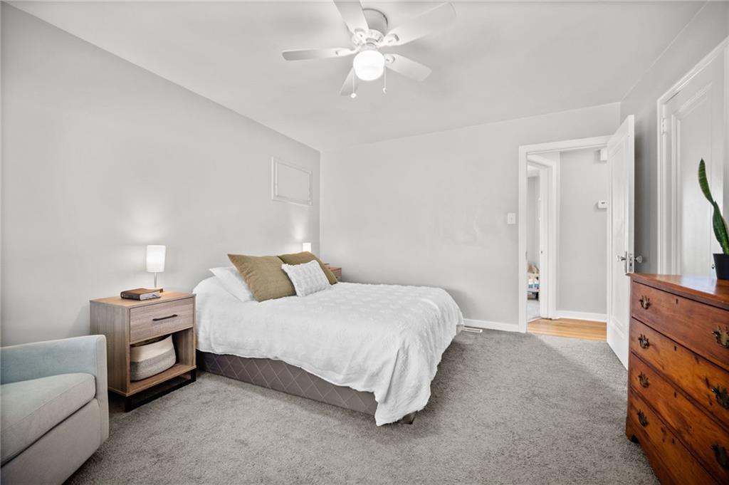 416 Phillips Avenue McKees Rocks, PA 15136 - Photo 21 of 46 a spacious bedroom with a bed and furniture