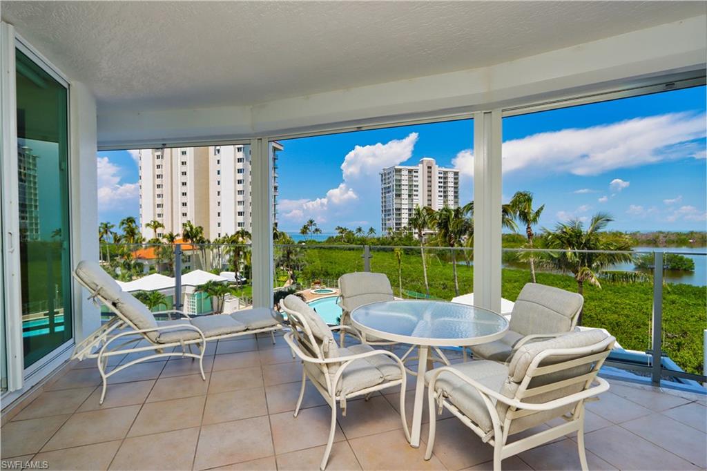60 Seagate Drive, Unit 402 Naples, FL 34103 - Photo 1 of 26 a view of an outdoor seating area