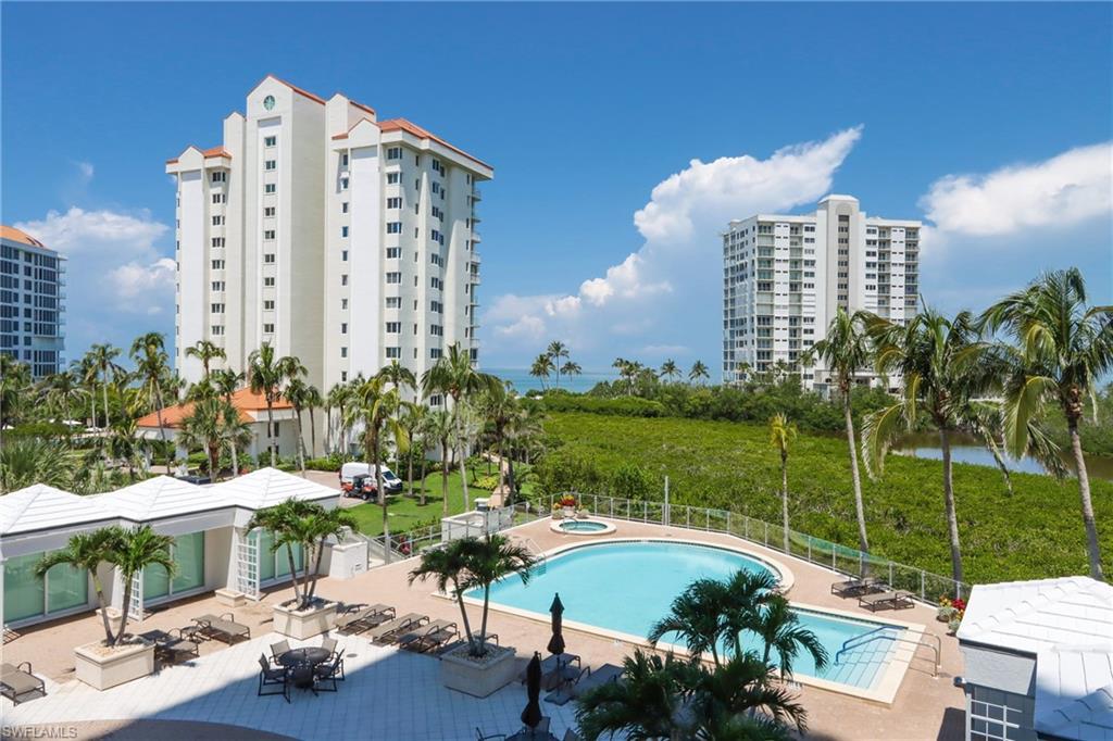 60 Seagate Drive, Unit 402 Naples, FL 34103 - Photo 3 of 26 a view of a city with tall buildings