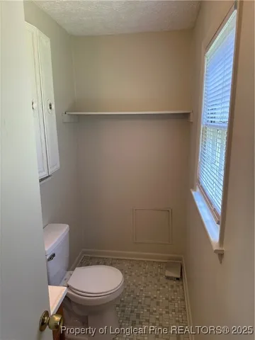 a view of a house with yard and sitting area