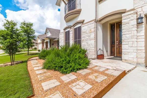 a view of a building with a yard