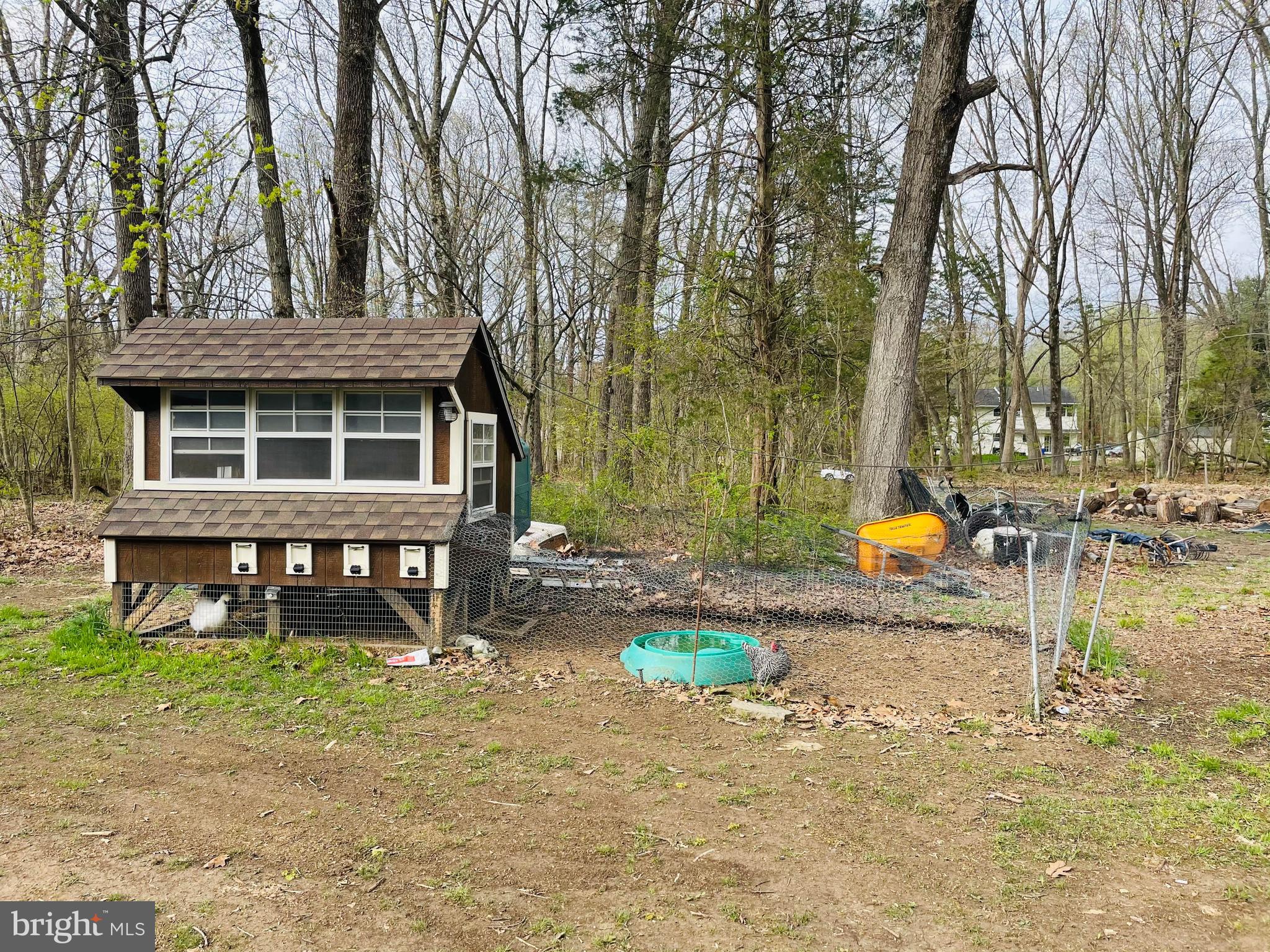 9 View Road Perkiomenville, PA 18074 - Photo 16 of 18 a backyard of a house with barbeque oven table and chairs