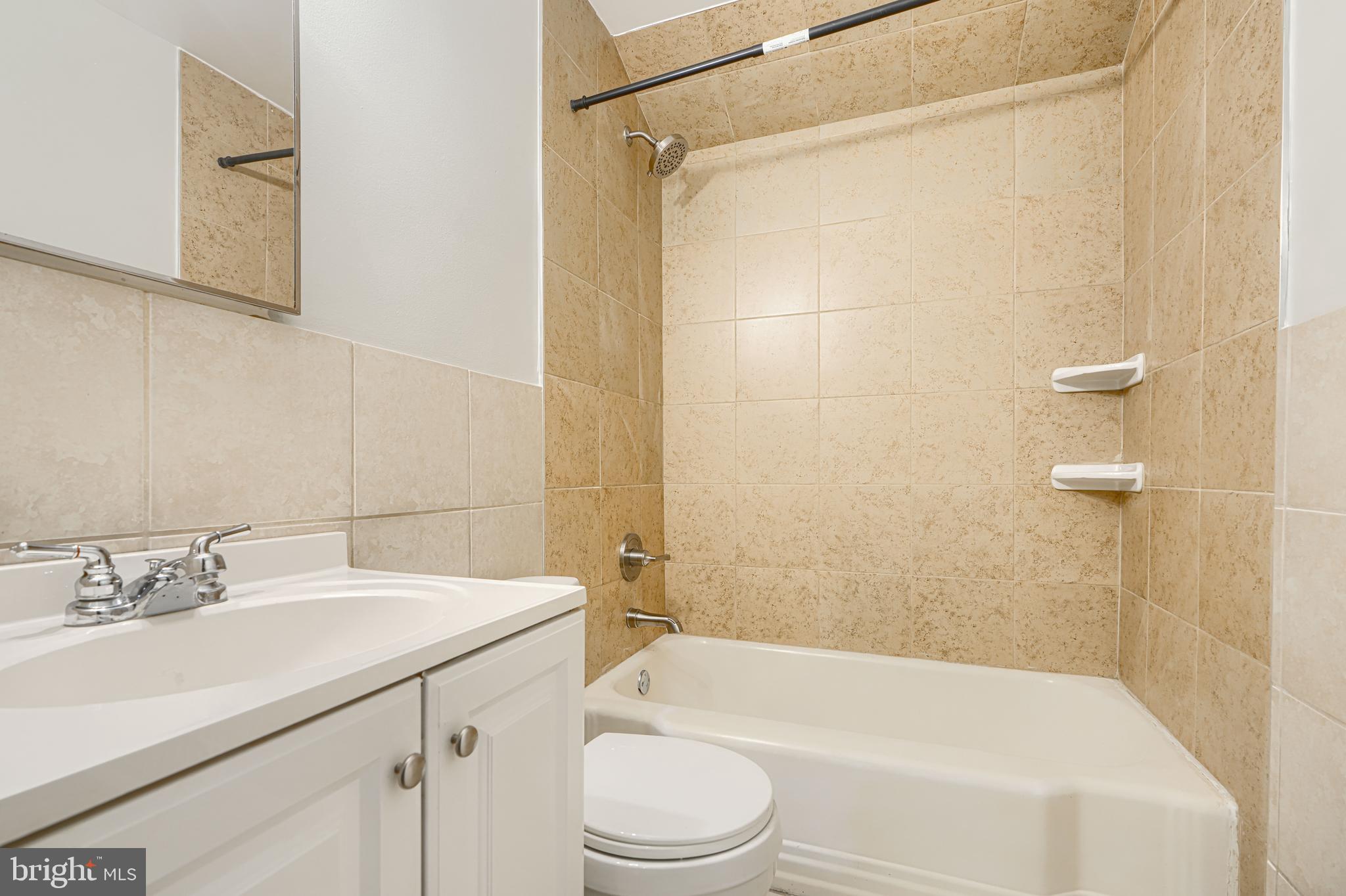 2073 Jasmine Road Baltimore, MD 21222 - Photo 15 of 29 a bathroom with a sink toilet and shower