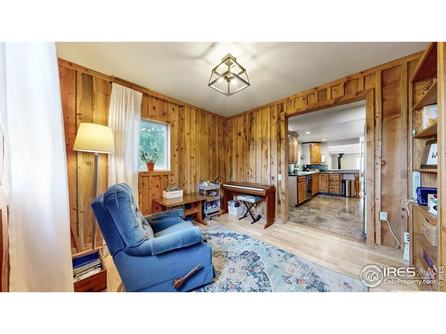 a living room with furniture and large windows