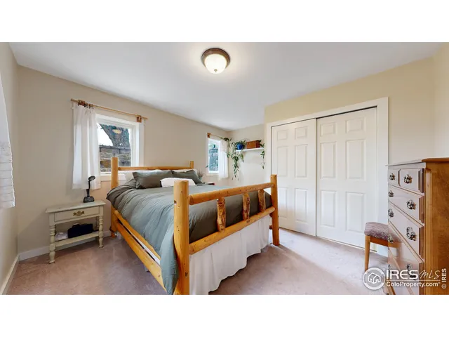 a bedroom with a bed and a cabinets