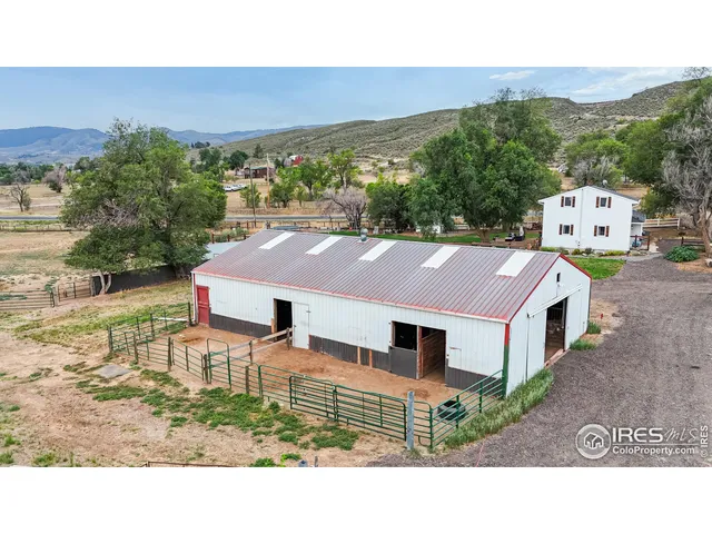 a aerial view of a house with a yard