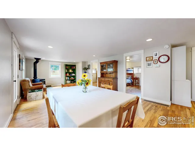 a kitchen with stainless steel appliances granite countertop a refrigerator a stove and a sink